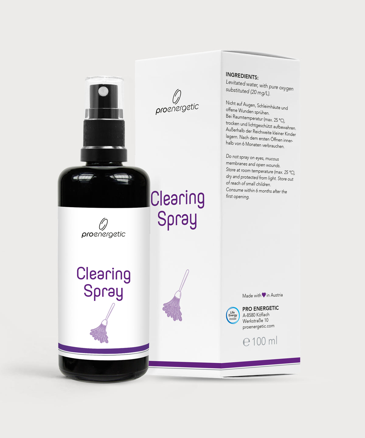Schwarze Sprayflasche mit weißem Etikett und der Aufschrift Clearing Spray steht vor der passenden weißen ProEnergetic Verpackung auf hellem Hintergrund
