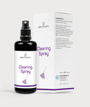 Schwarze Sprayflasche mit weißem Etikett und der Aufschrift Clearing Spray steht vor der passenden weißen ProEnergetic Verpackung auf hellem Hintergrund