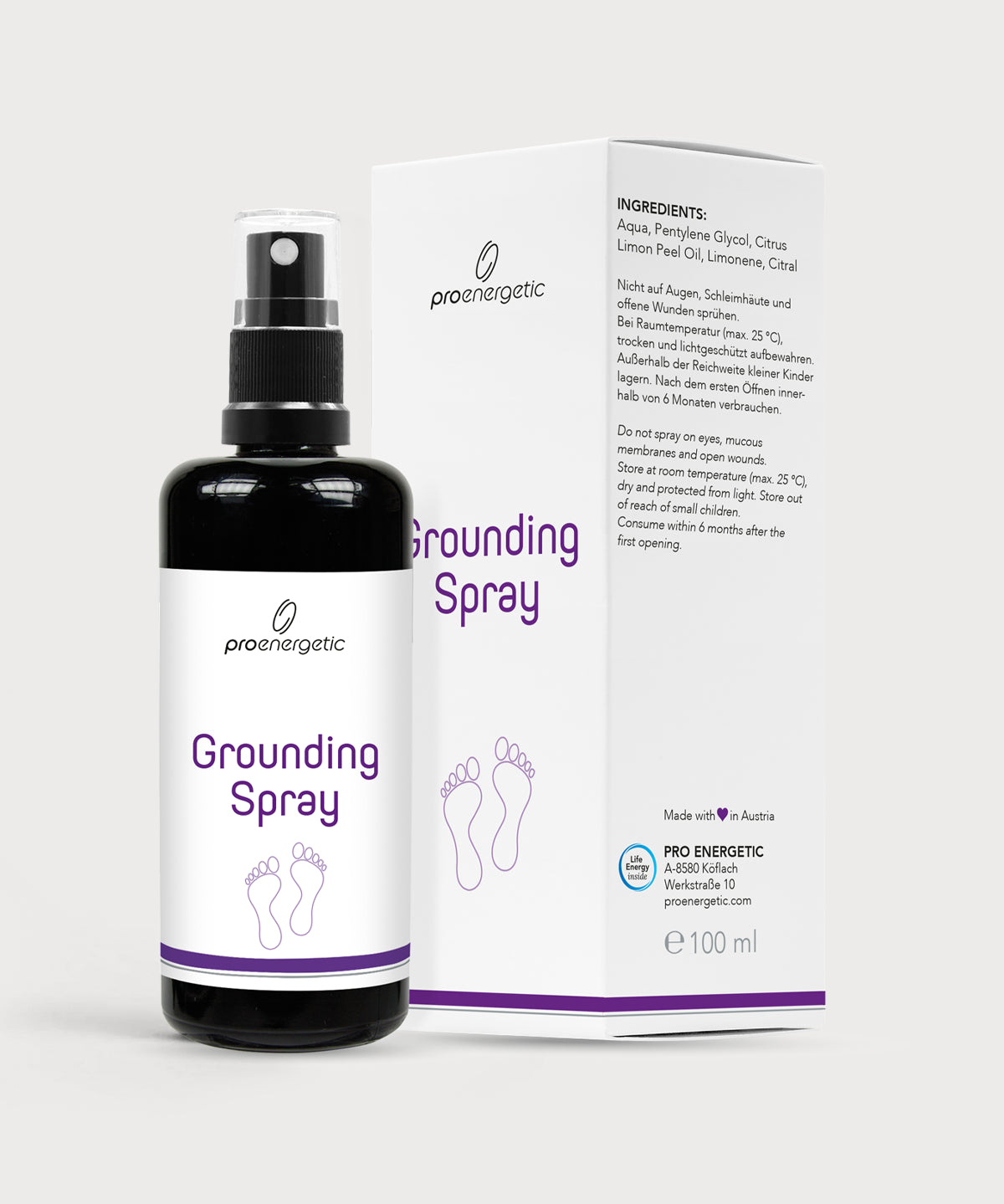 Grounding Spray in schwarzer Sprühflasche mit weißem Etikett, daneben weiße Produktverpackung mit violettem Schriftzug auf hellem Hintergrund