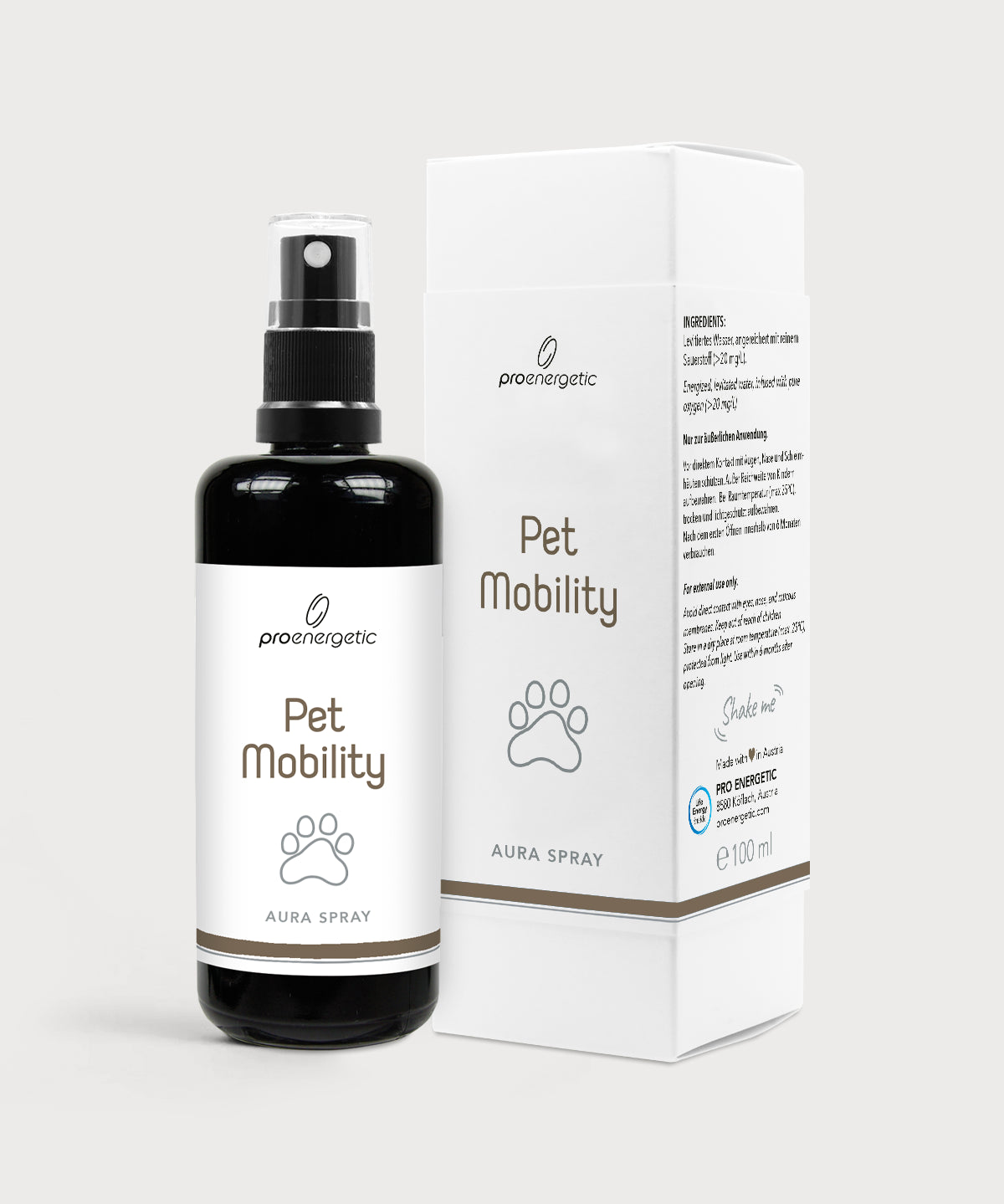 Schwarze Sprayflasche „Pet Mobility“ von proenergetic mit weißem Etikett und Pfoten-Symbol, daneben die passende weiße Produktverpackung. Aufdruck „Aura Spray“. Freigestellt vor hellem, neutralem Hintergrund.